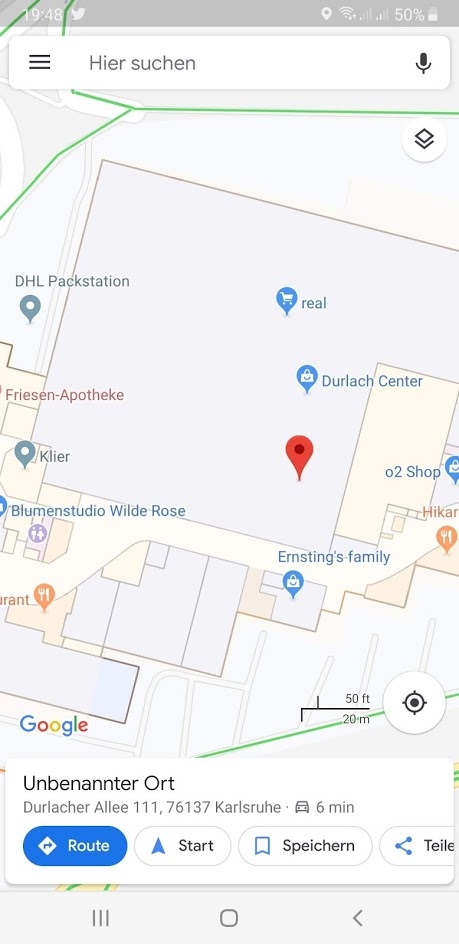 Mobiler Screenshot von Google Maps mit Geschäften und einem Ortungspin...