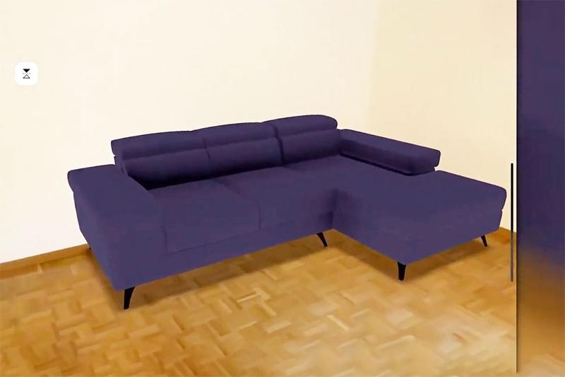 Ein virtuelles lila Sofa steht in einem Raum per Augmented Reality...